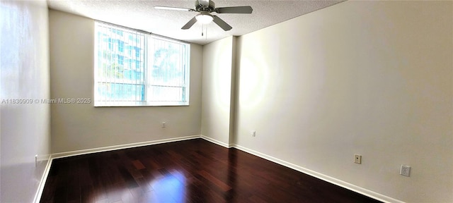 2000 N Bayshore Dr Unit 509, Miami, FL 33137 - unfurnished room featuring a ceiling fan, dark wood finished floors, and a textured ceiling