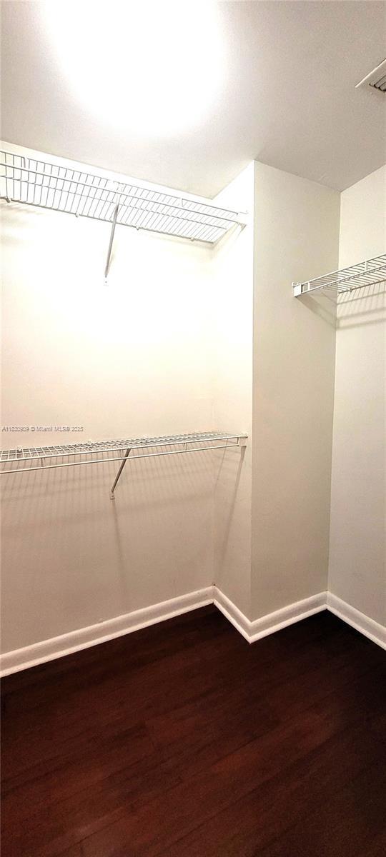 2000 N Bayshore Dr Unit 509, Miami, FL 33137 - spacious closet with dark wood-style flooring