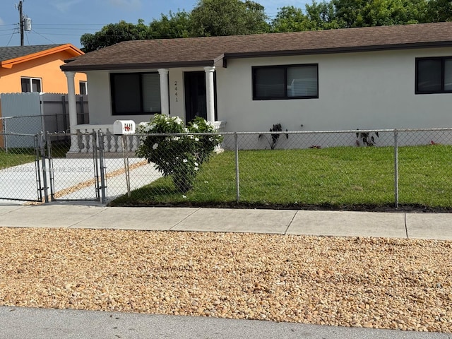 2441 NW 140th St, Opa Locka, FL 33054 - view of front facade with a gate, stucco siding, and a shingled roof