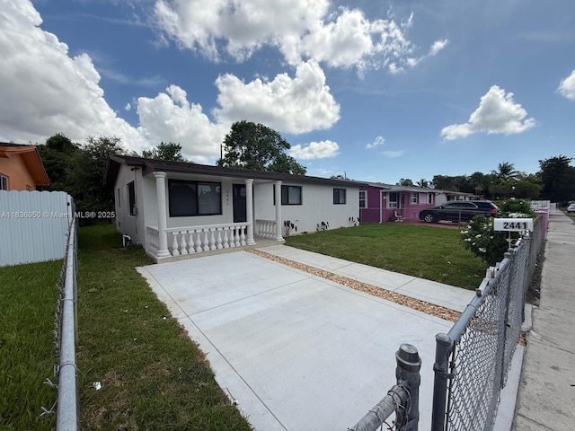 2441 NW 140th St, Opa Locka, FL 33054 - view of front of home with a porch and stucco siding