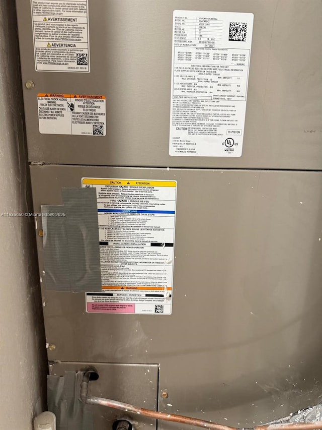 2441 NW 140th St, Opa Locka, FL 33054 - utility room featuring heating unit