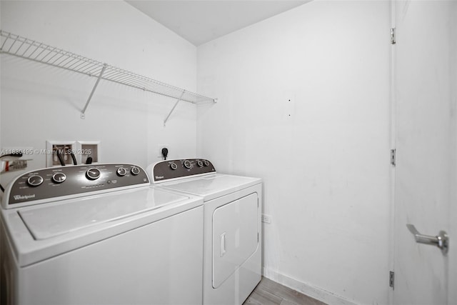 999 SW 1st Ave Unit 1615, Miami, FL 33130 - laundry room featuring washer and dryer and light wood finished floors