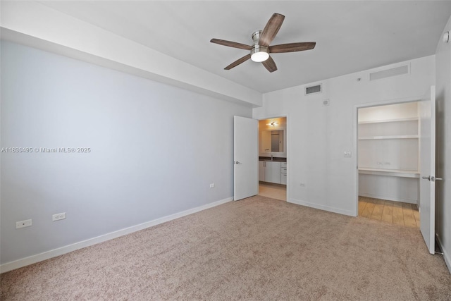 999 SW 1st Ave Unit 1615, Miami, FL 33130 - unfurnished bedroom with carpet flooring, ceiling fan, and ensuite bath