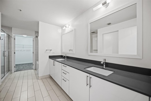999 SW 1st Ave Unit 1615, Miami, FL 33130 - bathroom featuring a shower stall, double vanity, and a tub to relax in