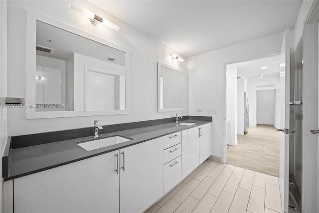 999 SW 1st Ave Unit 1615, Miami, FL 33130 - full bath with double vanity and baseboards