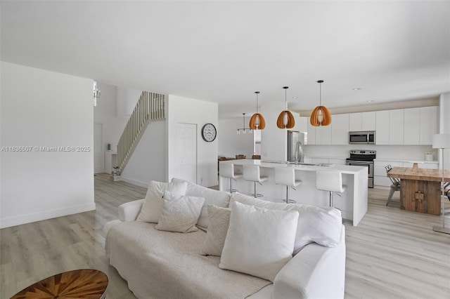 1249 Chenille Cir, Weston, FL 33327 - living area featuring light wood finished floors and stairs