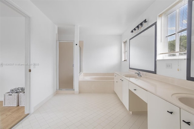 1249 Chenille Cir, Weston, FL 33327 - bathroom featuring a garden tub, a shower stall, double vanity, and tile patterned flooring