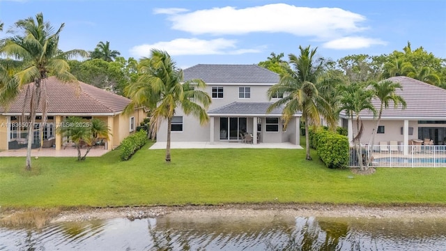 1249 Chenille Cir, Weston, FL 33327 - back of house with stucco siding, a water view, a patio area, and a tile roof