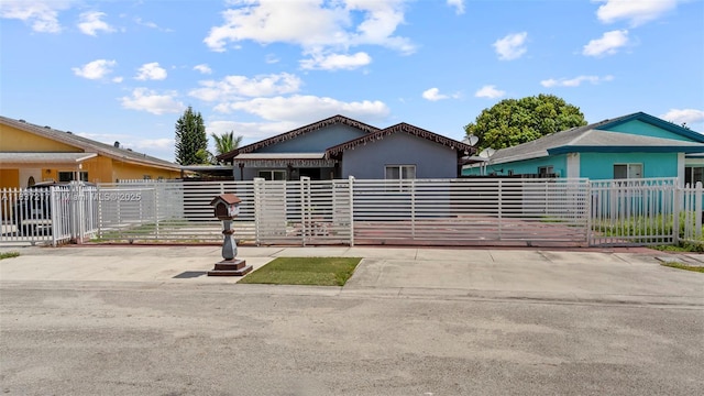 3109 NW 64th St, Miami, FL 33147 - view of front of property with a fenced front yard, a gate, and stucco siding