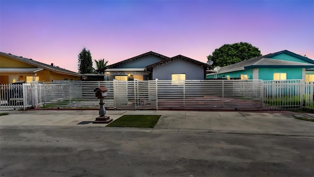 3109 NW 64th St, Miami, FL 33147 - view of front facade with a fenced front yard, a gate, and stucco siding