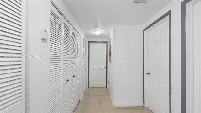 3109 NW 64th St, Miami, FL 33147 - corridor featuring light tile patterned flooring
