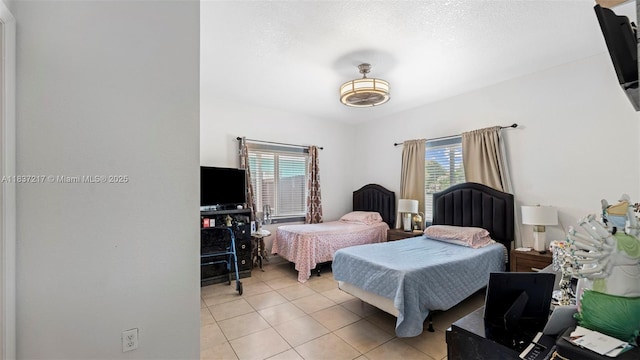 3109 NW 64th St, Miami, FL 33147 - bedroom featuring light tile patterned flooring
