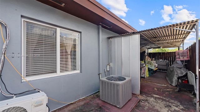 3109 NW 64th St, Miami, FL 33147 - view of home's exterior with a central AC unit and stucco siding