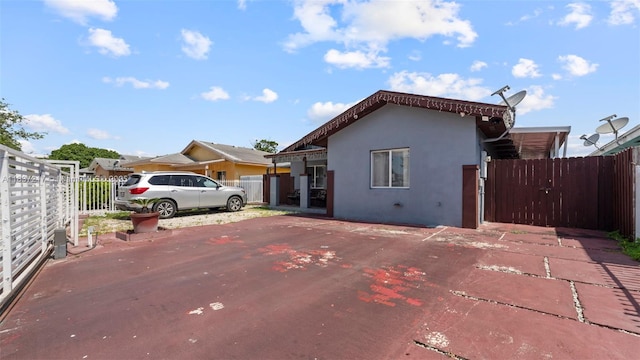 3109 NW 64th St, Miami, FL 33147 - view of front of property with stucco siding and a gate