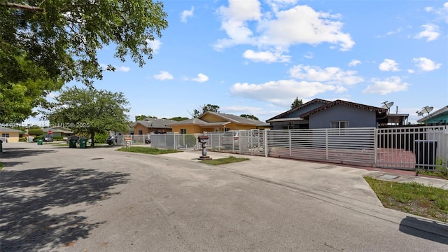 3109 NW 64th St, Miami, FL 33147 - view of front of property with a gate, stucco siding, and a residential view