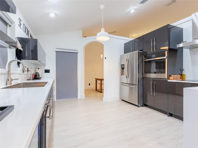 6110 Pitch Ln, Boynton Beach, FL 33437 - kitchen featuring appliances with stainless steel finishes, light wood-style floors, modern cabinets, and light countertops