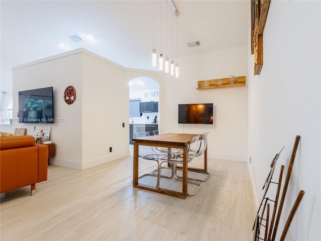 6110 Pitch Ln, Boynton Beach, FL 33437 - dining room featuring light wood finished floors and arched walkways
