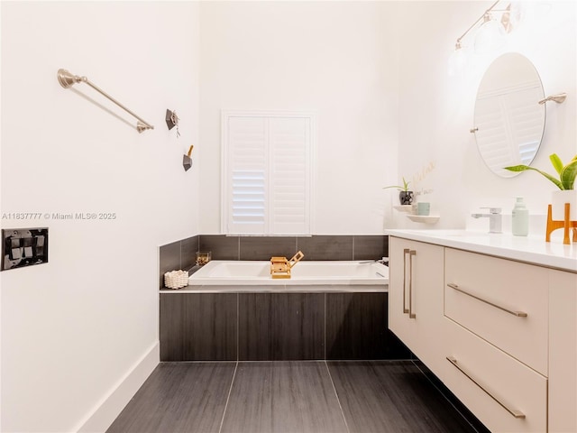 6110 Pitch Ln, Boynton Beach, FL 33437 - bathroom featuring vanity, a bath, and wood finished floors