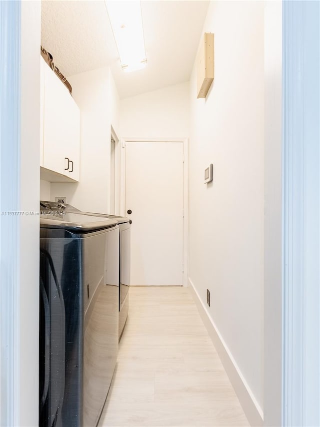 6110 Pitch Ln, Boynton Beach, FL 33437 - laundry area with cabinet space, independent washer and dryer, and light wood-style floors