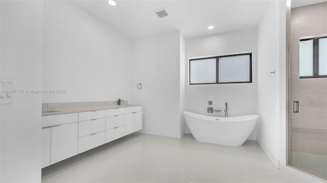 23120 SW 154th Ct, Miami, FL 33170 - bathroom with a soaking tub, a stall shower, double vanity, recessed lighting, and tile patterned flooring