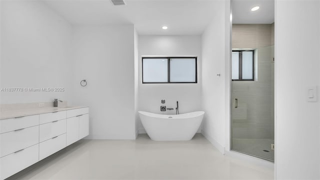 23120 SW 154th Ct, Miami, FL 33170 - bathroom with a shower stall, a freestanding bath, vanity, and recessed lighting