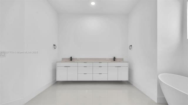 23120 SW 154th Ct, Miami, FL 33170 - full bath featuring double vanity, a freestanding tub, and recessed lighting