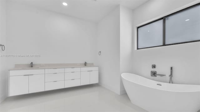 23120 SW 154th Ct, Miami, FL 33170 - bathroom with double vanity, a freestanding bath, and recessed lighting