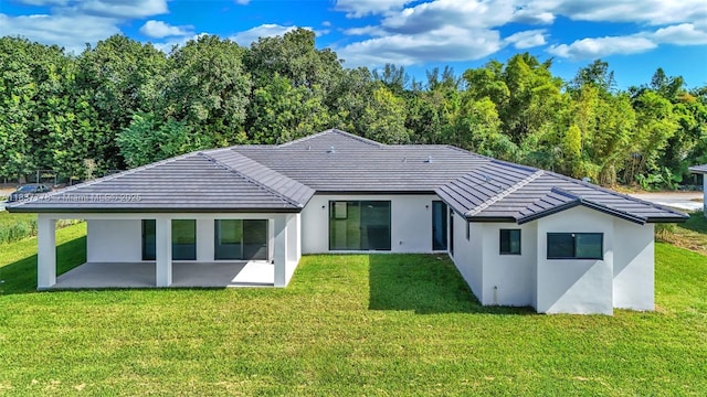 23120 SW 154th Ct, Miami, FL 33170 - back of house with a patio area, a yard, stucco siding, and a tile roof