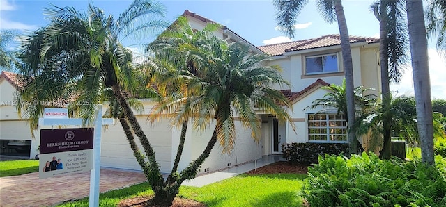 2957 Oak Park Cir, Davie, FL 33328 - mediterranean / spanish house with stucco siding, a tile roof, decorative driveway, and an attached garage