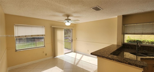 2957 Oak Park Cir, Davie, FL 33328 - dining area with light tile patterned floors, a ceiling fan, and a textured ceiling