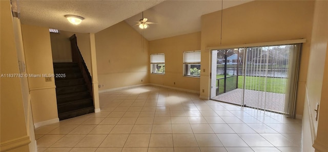 2957 Oak Park Cir, Davie, FL 33328 - unfurnished room with a ceiling fan, stairs, high vaulted ceiling, light tile patterned flooring, and a textured ceiling