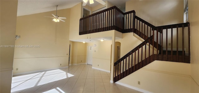 2957 Oak Park Cir, Davie, FL 33328 - stairway with a ceiling fan, tile patterned flooring, high vaulted ceiling, and arched walkways