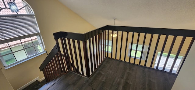 2957 Oak Park Cir, Davie, FL 33328 - staircase with wood finished floors, a chandelier, and vaulted ceiling