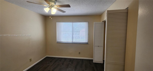 2957 Oak Park Cir, Davie, FL 33328 - unfurnished bedroom featuring a textured ceiling, dark wood-style flooring, a closet, and ceiling fan