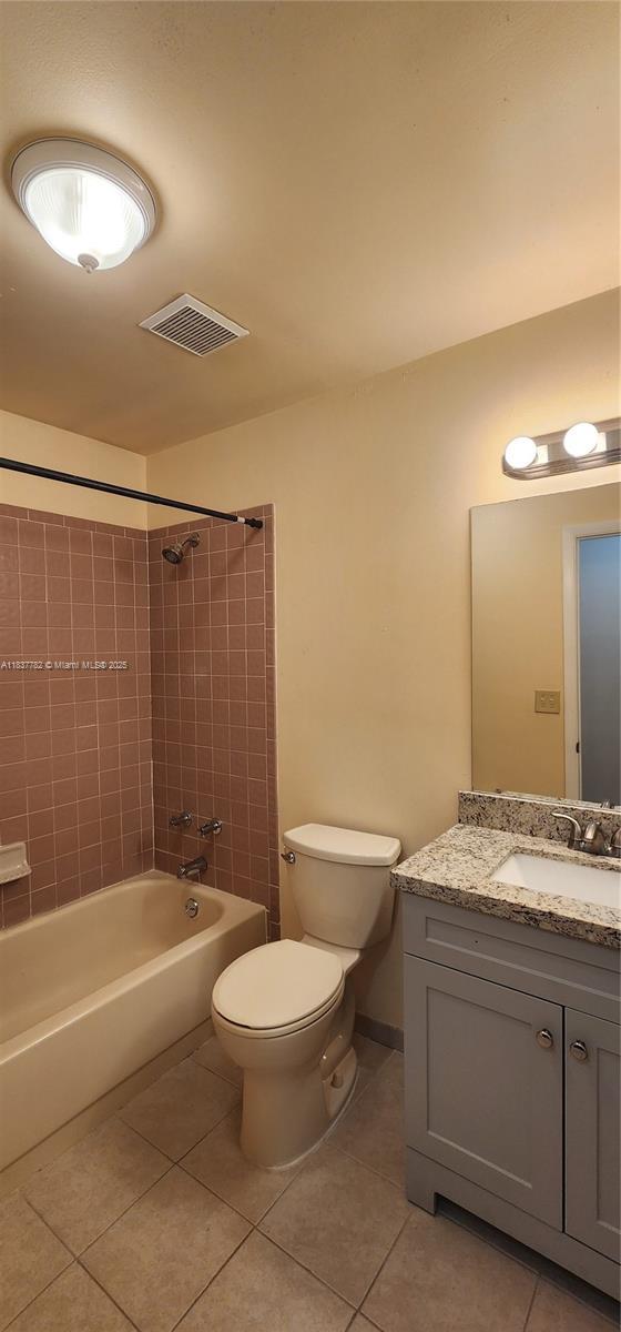 2957 Oak Park Cir, Davie, FL 33328 - full bath featuring tile patterned flooring, vanity, and  shower combination