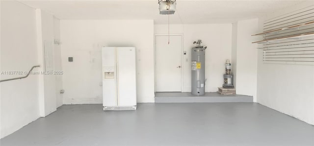 2957 Oak Park Cir, Davie, FL 33328 - garage featuring white refrigerator with ice dispenser, water heater, and a garage door opener