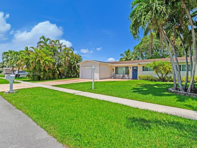 321 NW 93rd Ave, Pembroke Pines, FL 33024 - single story home with concrete driveway, a garage, stucco siding, and a front lawn