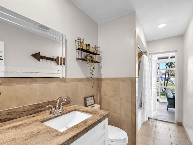 321 NW 93rd Ave, Pembroke Pines, FL 33024 - full bathroom featuring vanity, tile patterned flooring, shower / bath combo with shower curtain, and tile walls