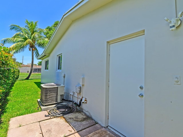 321 NW 93rd Ave, Pembroke Pines, FL 33024 - view of property exterior featuring stucco siding, a lawn, and a patio