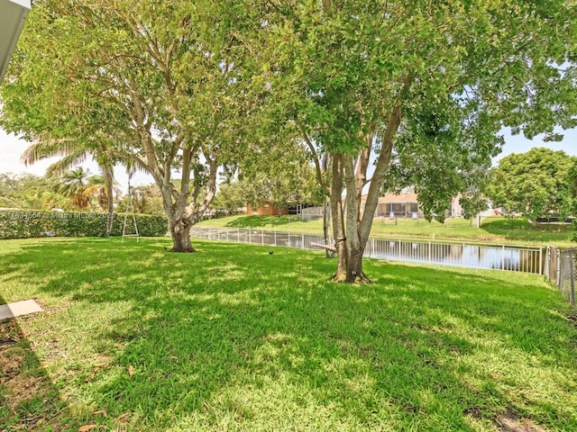 321 NW 93rd Ave, Pembroke Pines, FL 33024 - fenced backyard featuring a water view