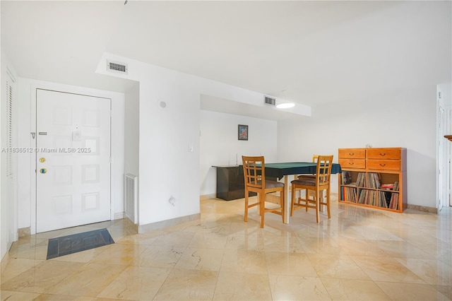 1201 S Ocean Dr Unit 410S, Hollywood, FL 33019 - dining room featuring light marble finish floors and baseboards