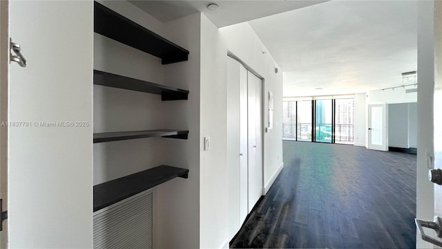 350 S Miami Ave Unit 2401, Miami, FL 33130 - corridor with dark wood-style floors and expansive windows