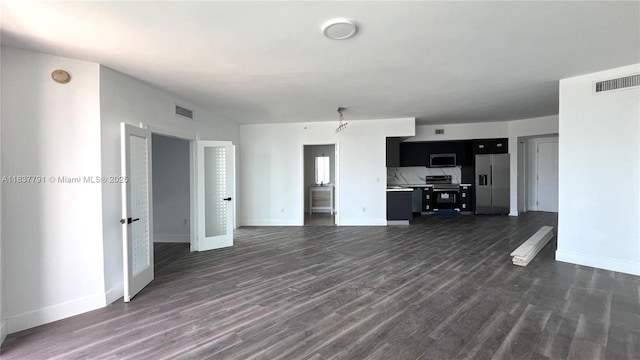 350 S Miami Ave Unit 2401, Miami, FL 33130 - unfurnished living room featuring dark wood-style flooring