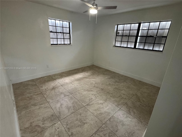 2855 SW 10th St, Fort Lauderdale, FL 33312 - spare room featuring ceiling fan and baseboards