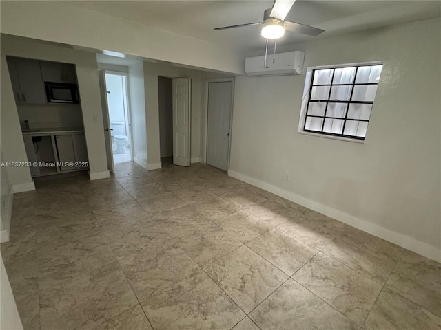 2855 SW 10th St, Fort Lauderdale, FL 33312 - spare room featuring a wall unit AC and a ceiling fan