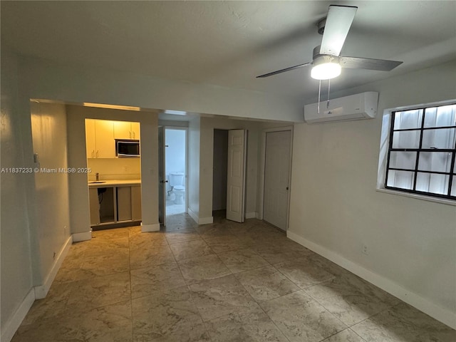 2855 SW 10th St, Fort Lauderdale, FL 33312 - spare room with a wall mounted AC and a ceiling fan