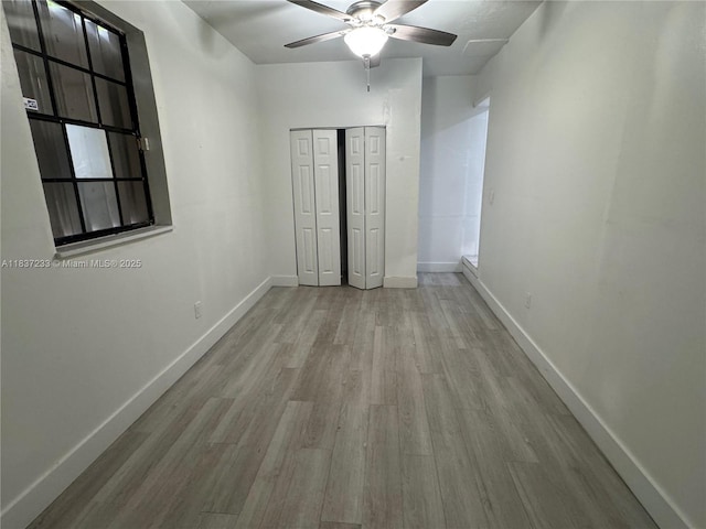 2855 SW 10th St, Fort Lauderdale, FL 33312 - unfurnished bedroom with wood finished floors, a closet, and a ceiling fan