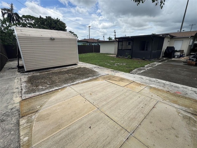 2855 SW 10th St, Fort Lauderdale, FL 33312 - view of patio / terrace featuring a shed and a sunroom