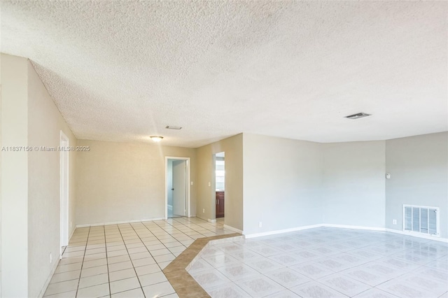 5640 NW 13th Ct, Lauderhill, FL 33313 - empty room with light tile patterned floors and a textured ceiling