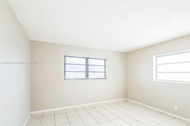 5640 NW 13th Ct, Lauderhill, FL 33313 - empty room with plenty of natural light and light tile patterned floors